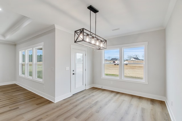 interior space featuring crown molding and light wood-type flooring