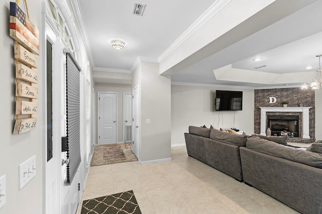 6 Piedmont Pl, Enterprise, AL 36330 - living area with a raised ceiling, crown molding, a fireplace, and light tile patterned floors