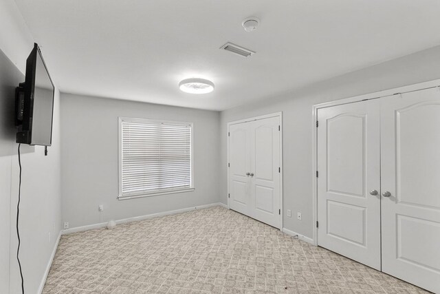 6 Piedmont Pl, Enterprise, AL 36330 - unfurnished bedroom featuring multiple closets and carpet floors