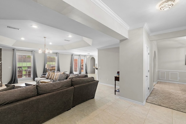 6 Piedmont Pl, Enterprise, AL 36330 - living area with arched walkways, a raised ceiling, a chandelier, light tile patterned flooring, and ornamental molding