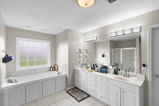 6 Piedmont Pl, Enterprise, AL 36330 - bathroom featuring double vanity, a shower stall, a garden tub, and tile patterned flooring