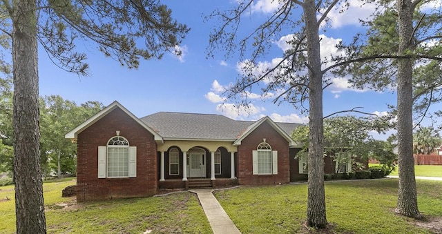 6 Piedmont Pl, Enterprise, AL 36330 - view of front of property with a front lawn, brick siding, and a shingled roof