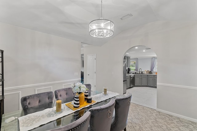 6 Piedmont Pl, Enterprise, AL 36330 - dining area featuring a chandelier, arched walkways, and vaulted ceiling