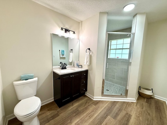 143 Durby Ln, Dothan, AL 36305 - full bath with vanity, wood finished floors, a shower stall, and a textured ceiling