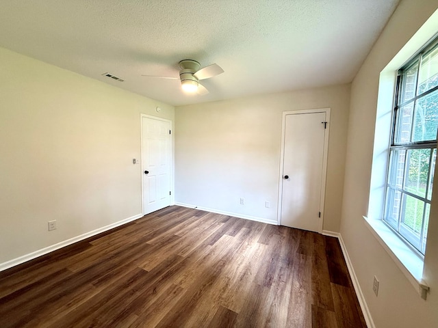 143 Durby Ln, Dothan, AL 36305 - unfurnished room with dark wood-style flooring, ceiling fan, and a textured ceiling