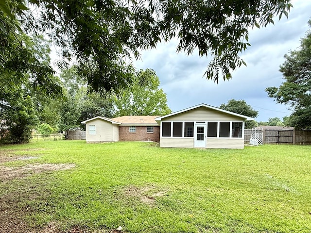 143 Durby Ln, Dothan, AL 36305 - back of property featuring a sunroom and a fenced backyard