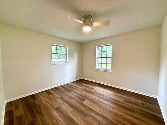 143 Durby Ln, Dothan, AL 36305 - empty room with dark wood-style floors, a ceiling fan, and a textured ceiling
