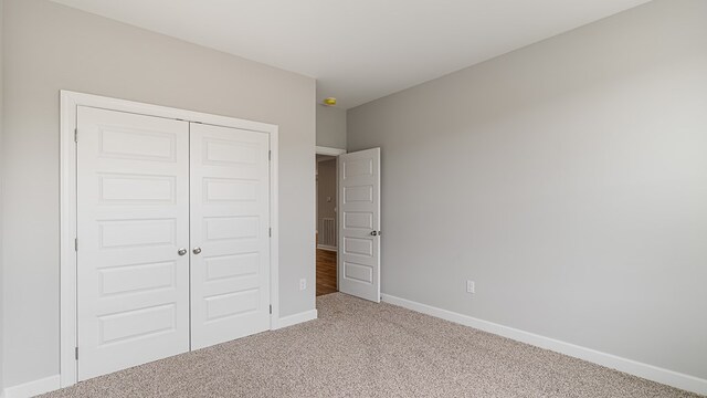330 Heritage Way, Headland, AL 36345 - unfurnished bedroom with carpet floors, a closet, and baseboards