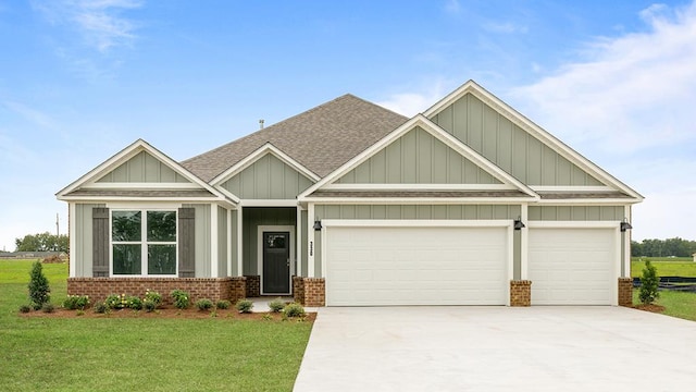 330 Heritage Way, Headland, AL 36345 - craftsman-style house featuring brick siding, roof with shingles, a garage, driveway, and a front lawn