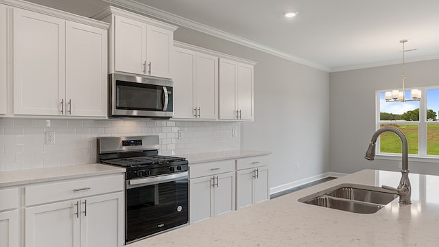 330 Heritage Way, Headland, AL 36345 - kitchen with a sink, white cabinetry, appliances with stainless steel finishes, tasteful backsplash, and crown molding