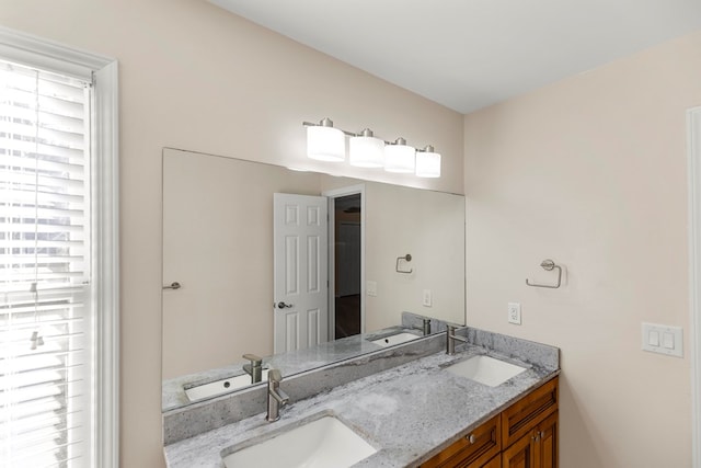 bathroom with a sink and a healthy amount of sunlight