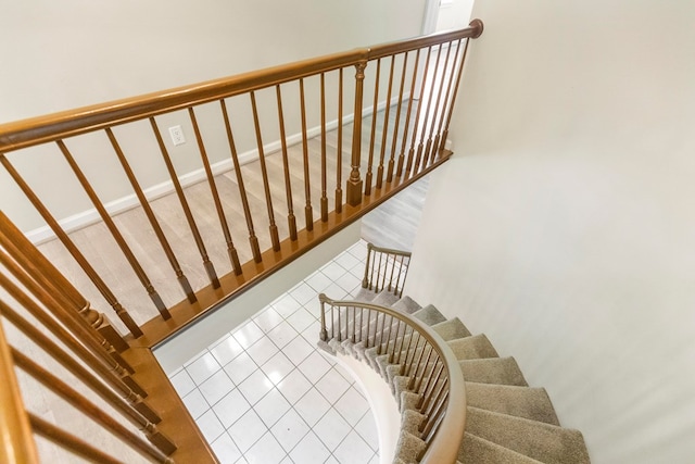 stairs with tile patterned flooring