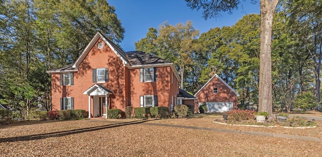 colonial house featuring brick siding