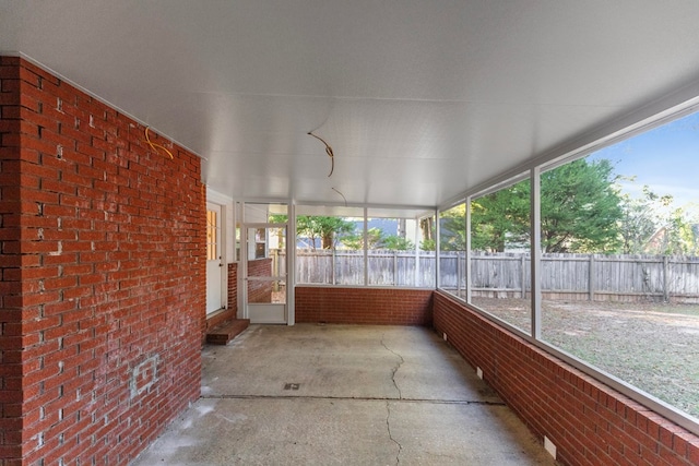 unfurnished sunroom with a healthy amount of sunlight