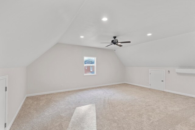 bonus room featuring carpet floors, baseboards, and vaulted ceiling