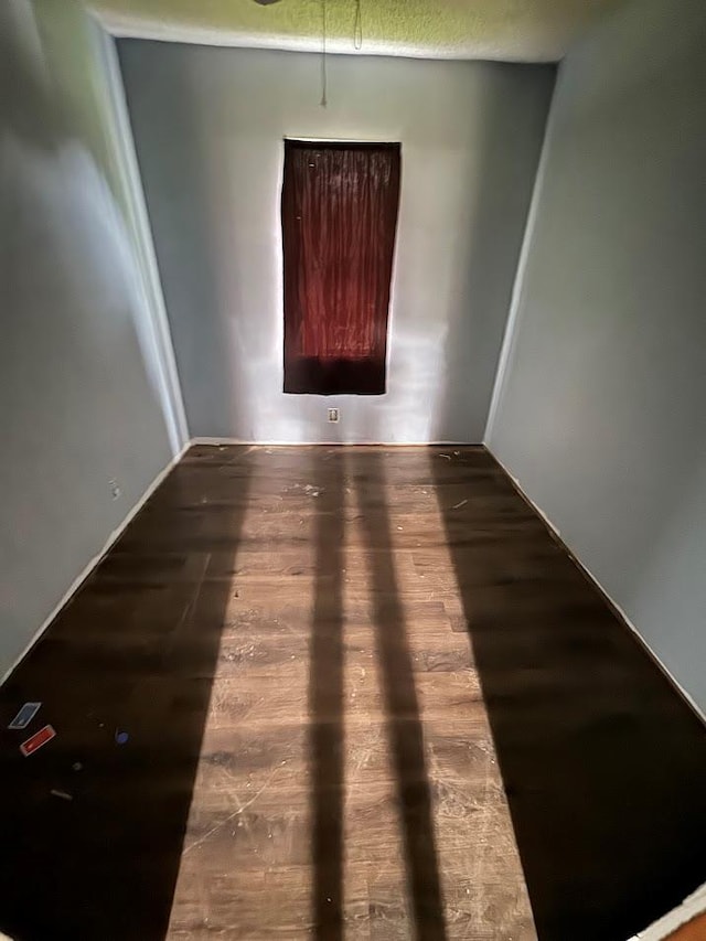 spare room with hardwood / wood-style flooring