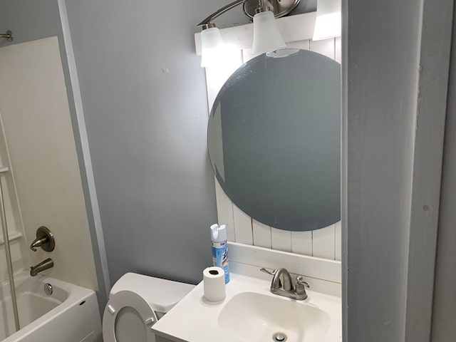 full bathroom featuring shower / bath combination, toilet, and vanity