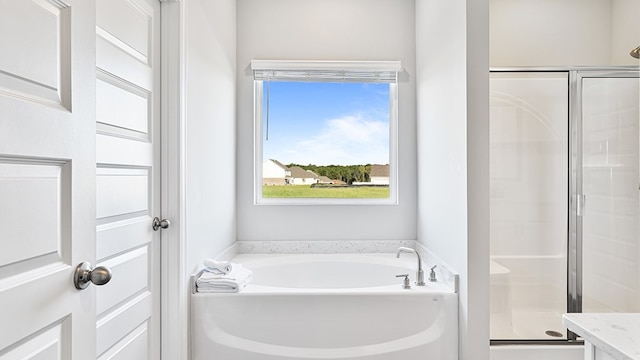 bathroom with independent shower and bath