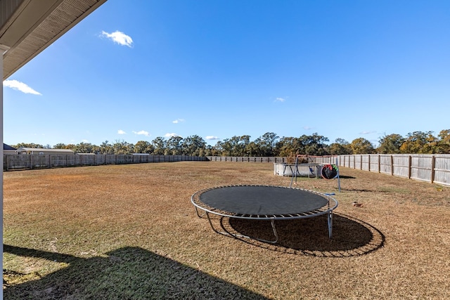 view of yard with a trampoline