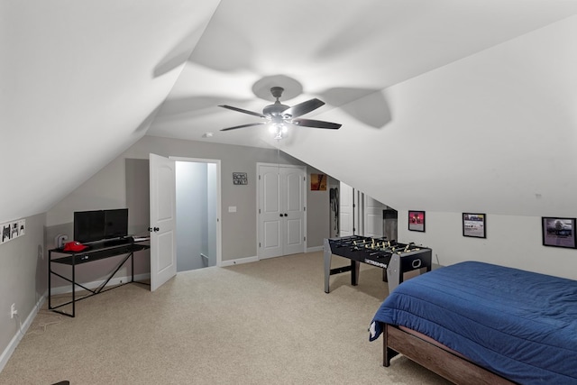 bedroom with light carpet, ceiling fan, and lofted ceiling