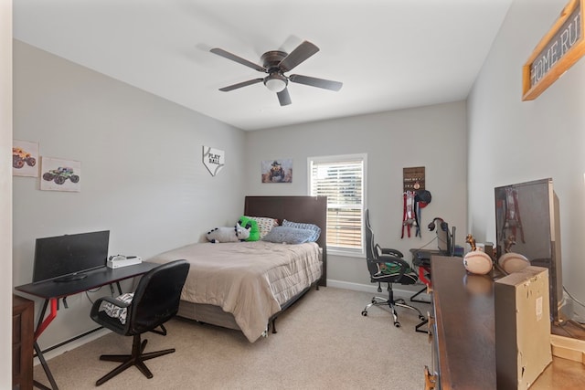 bedroom featuring ceiling fan and light carpet