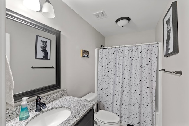 full bathroom with vanity, toilet, and shower / bath combo