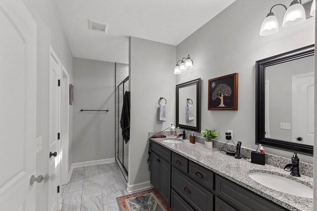 bathroom with vanity and walk in shower