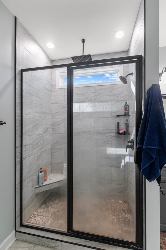 bathroom with plenty of natural light and an enclosed shower