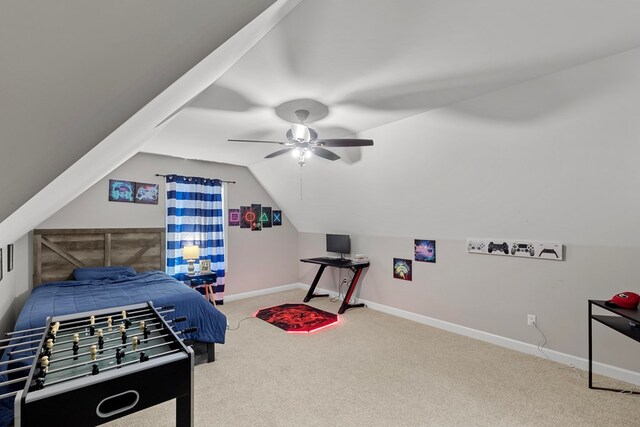 carpeted bedroom with ceiling fan and vaulted ceiling