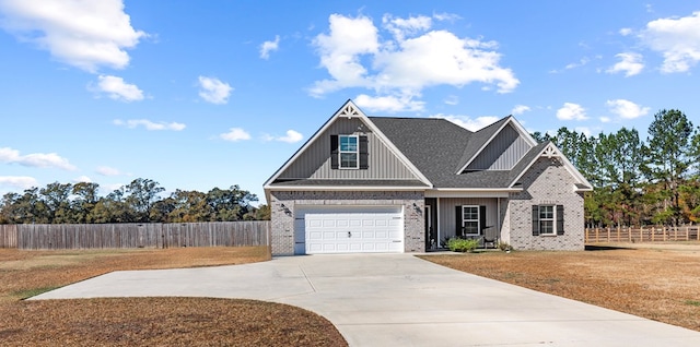 craftsman inspired home with a garage and a front yard