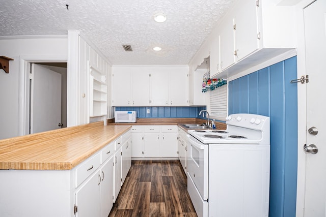 kitchen with white appliances, a sink, dark wood-type flooring, a textured ceiling, and white cabinetry