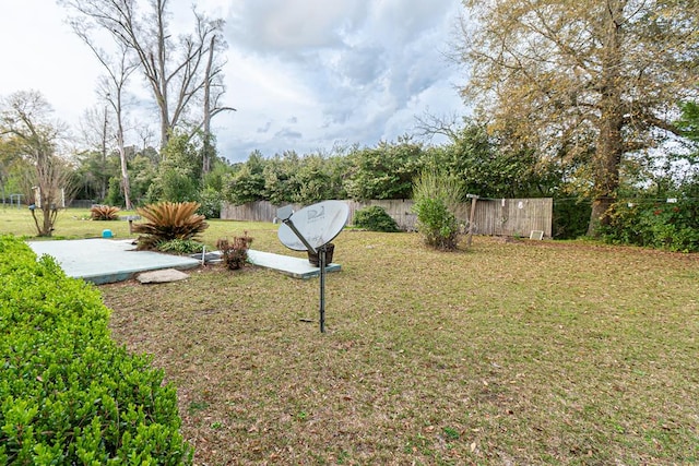 view of yard with a patio and fence