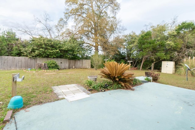 view of yard with a patio and fence