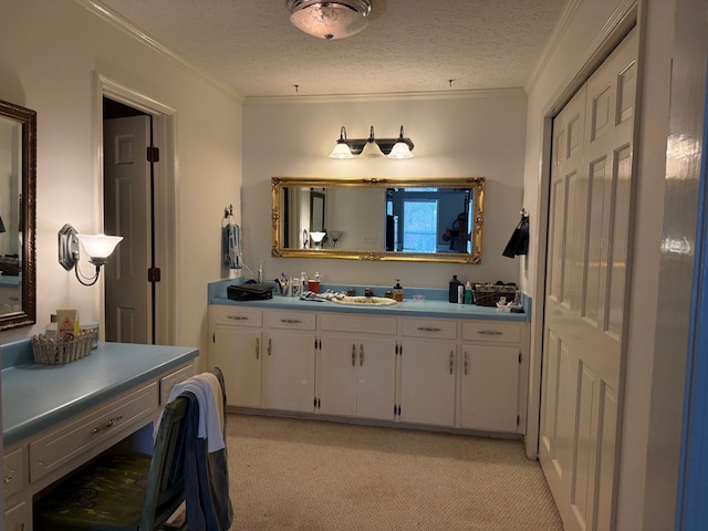 bathroom featuring crown molding and a textured ceiling