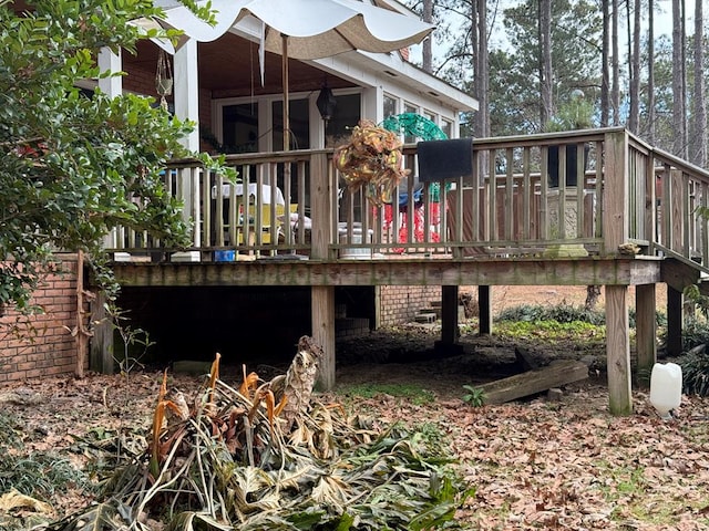 back of house featuring a deck