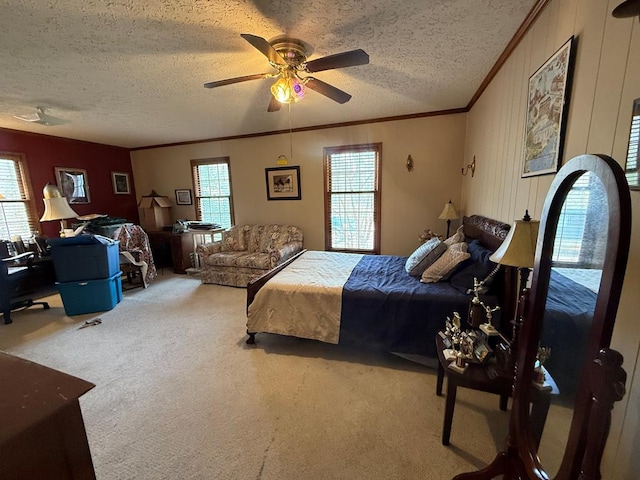 bedroom with multiple windows, crown molding, carpet, and a textured ceiling