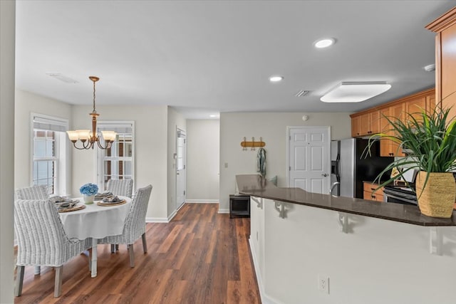 493 Shiloh Rd, Hartford, AL 36344 - kitchen with dark countertops, a chandelier, stainless steel fridge with ice dispenser, dark wood finished floors, and recessed lighting