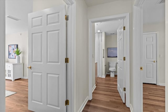493 Shiloh Rd, Hartford, AL 36344 - hallway with wood finished floors and baseboards
