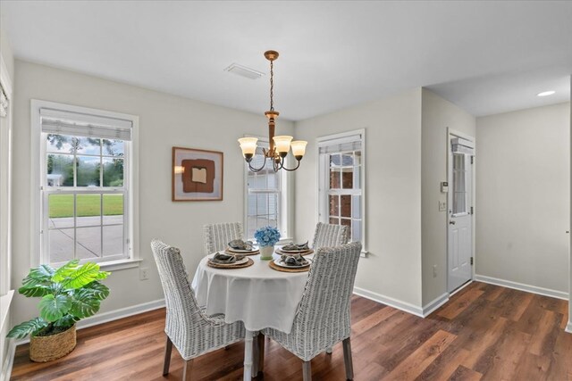 493 Shiloh Rd, Hartford, AL 36344 - dining space featuring a chandelier and dark wood-style flooring