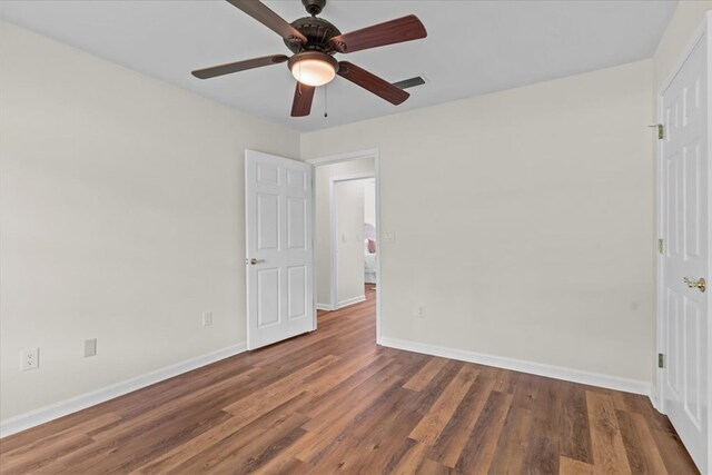 493 Shiloh Rd, Hartford, AL 36344 - unfurnished bedroom featuring wood finished floors and a ceiling fan