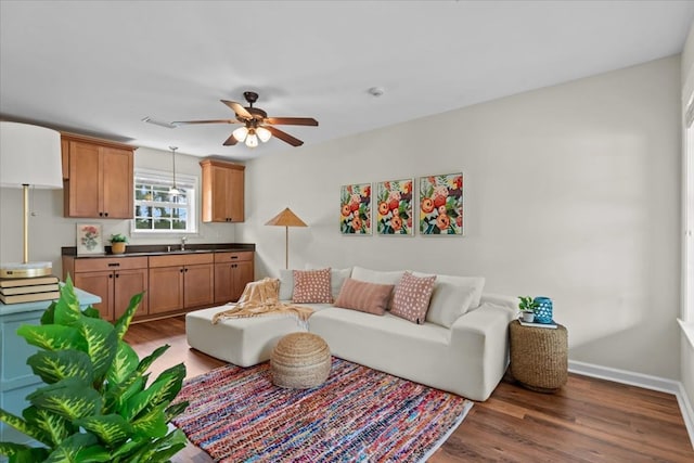 493 Shiloh Rd, Hartford, AL 36344 - living room with wood finished floors and a ceiling fan