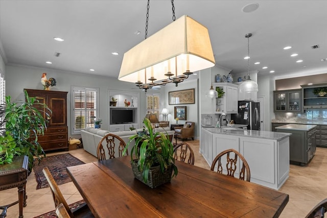 dining space featuring ornamental molding, recessed lighting, and visible vents