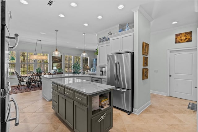 kitchen with crown molding, stainless steel appliances, visible vents, white cabinets, and light stone countertops