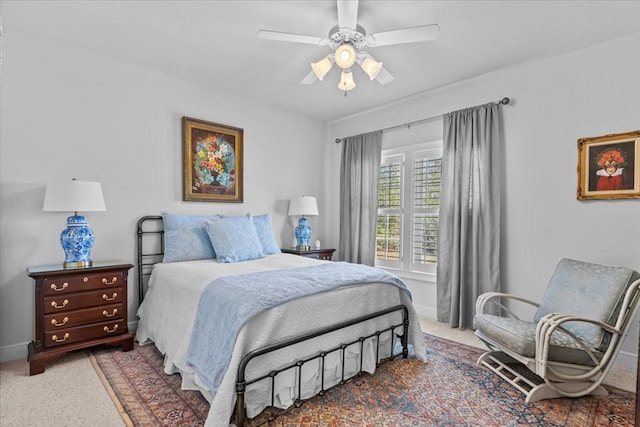 bedroom featuring ceiling fan, carpet floors, and baseboards