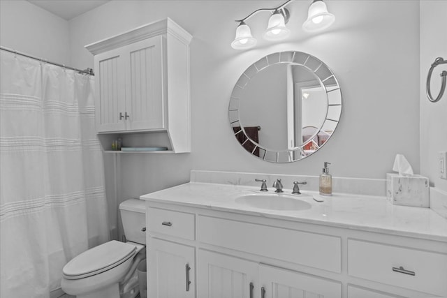 bathroom featuring toilet, a shower with curtain, and vanity