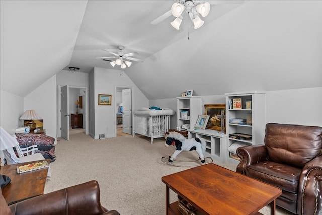 sitting room with light carpet, vaulted ceiling, and ceiling fan