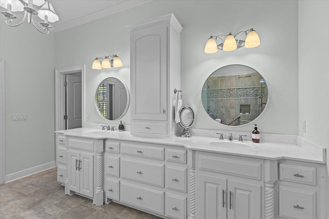 full bath with double vanity, ornamental molding, a sink, and baseboards