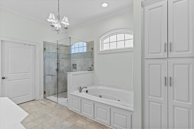 bathroom with an inviting chandelier, a shower stall, ornamental molding, and a bath