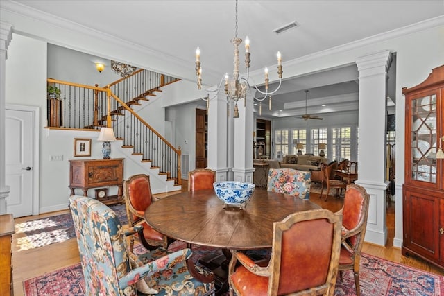 dining area with visible vents, crown molding, and ornate columns