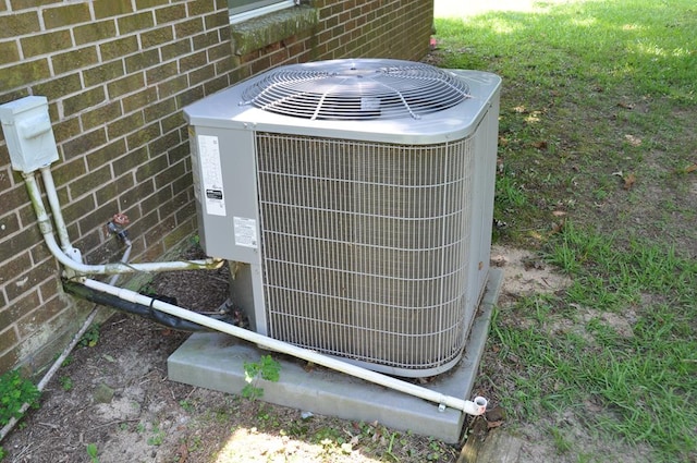 210 Anderson St, Kinston, AL 36453 - exterior view of a central air condition unit and brick siding